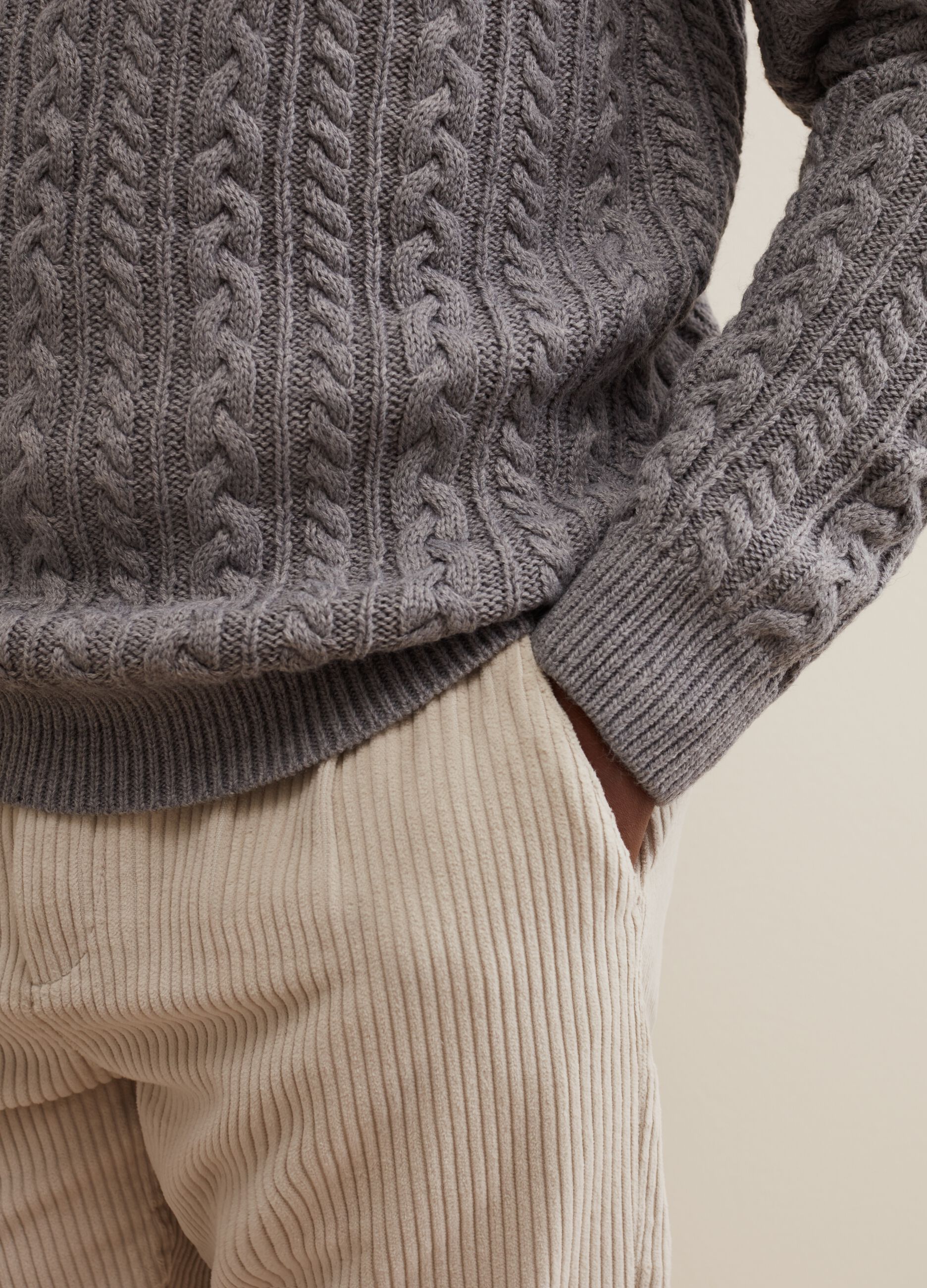 Turtleneck jumper with braided design