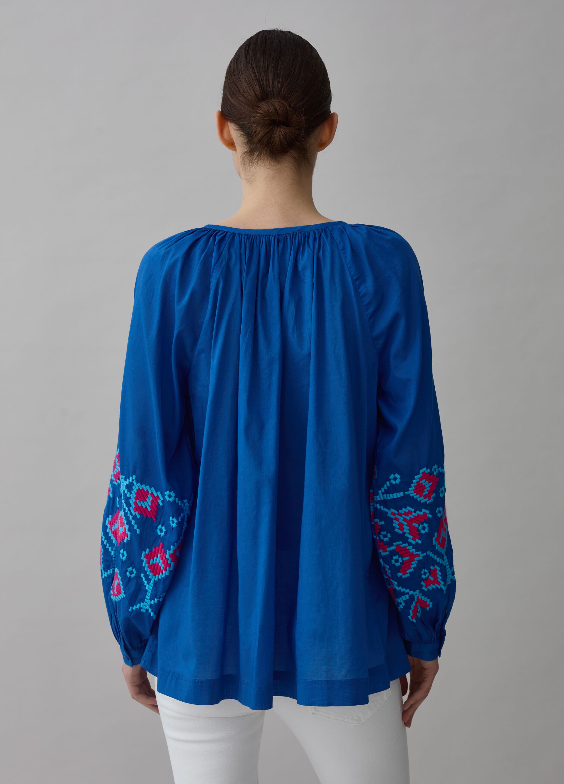 Oversized blouse with ethnic embroidery and tassels